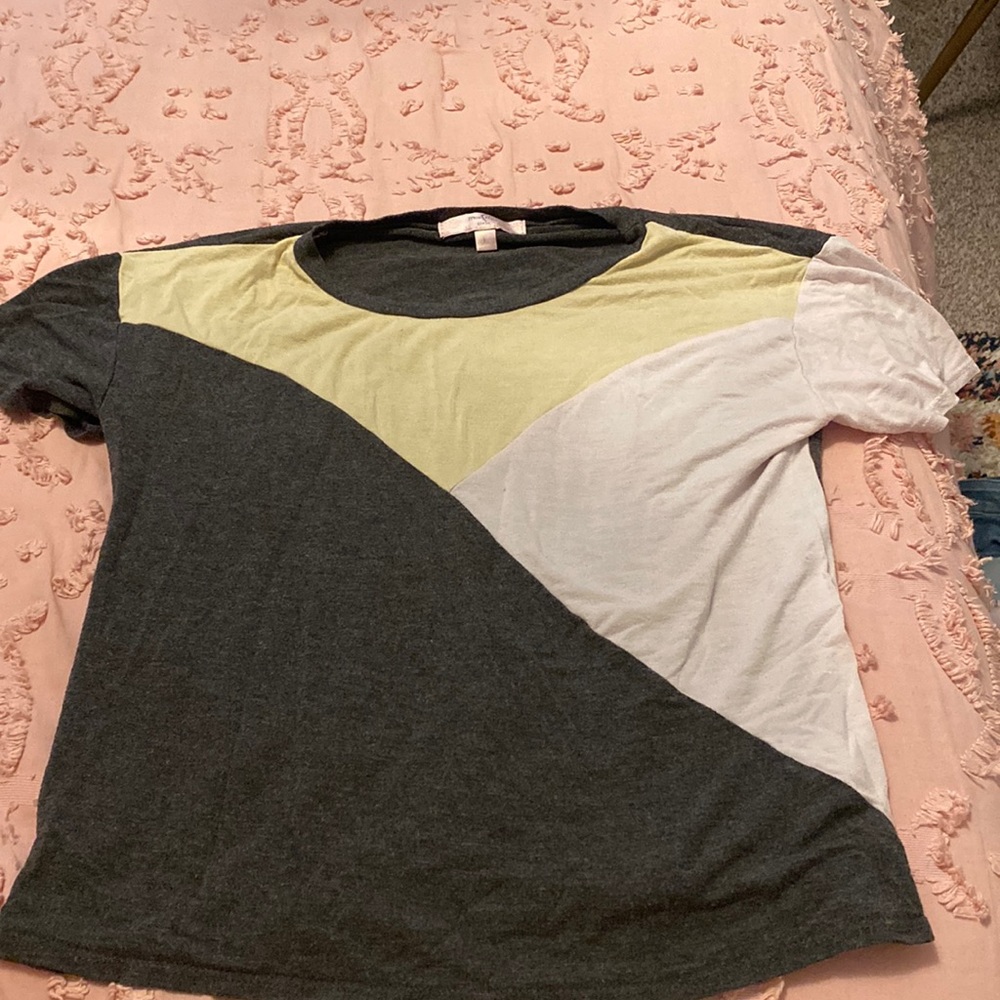 This shirt is white, Yellow, and black